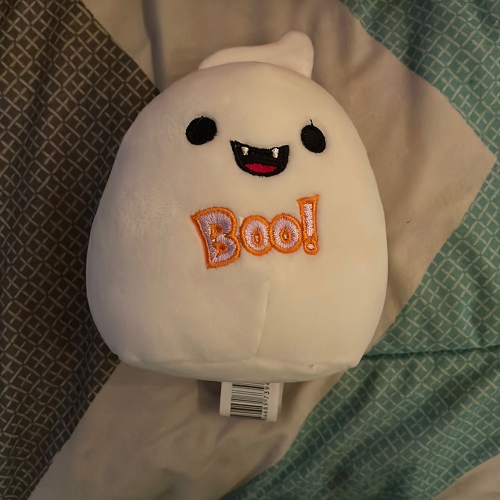 Halloween squishmallow (hand for scale)